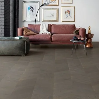 Worn, low-quality flooring showing signs of premature wear