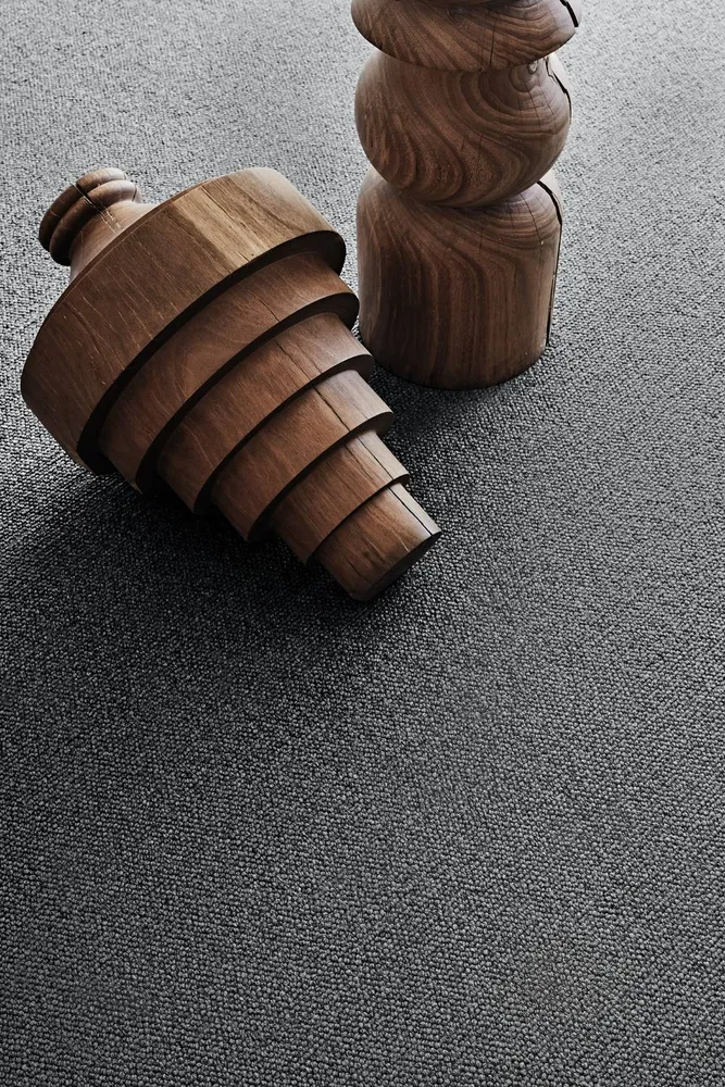 Close-up of grey carpet texture with timber objects, Camberwell Floorworld