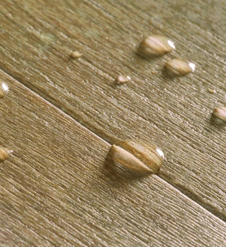 Close-up of water droplets on water-resistant timber-look flooring, Camberwell Floorworld